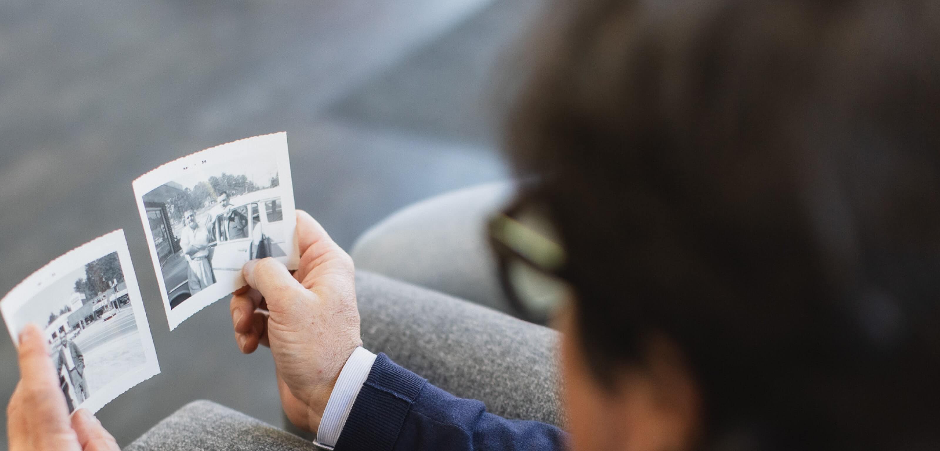 Dr. Suber Looking at History Photos